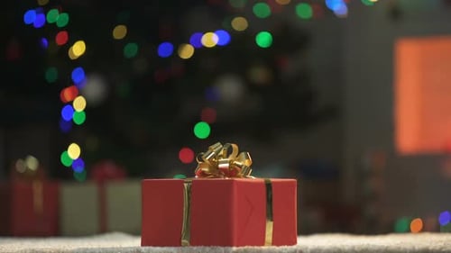 Festive Christmas Gift by the Fireplace