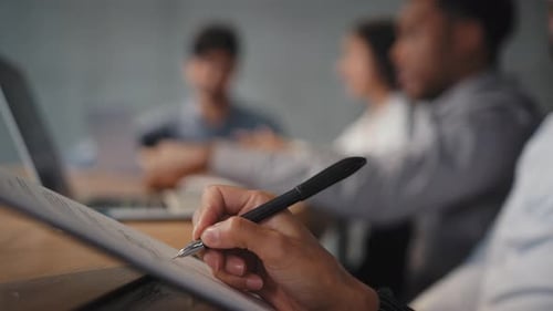Business Meeting Writing on Paper in Office