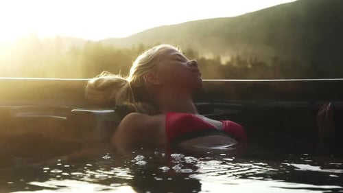 Woman Reclining In Steamy Hot Tub