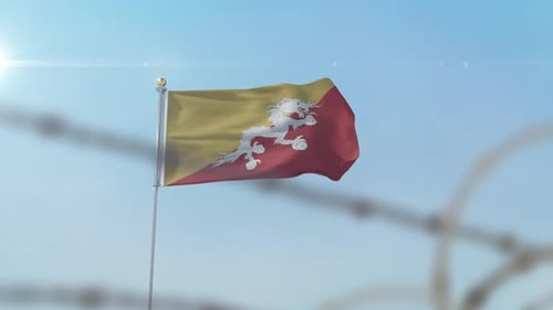 Bhutan Flag Waving Behind Barbed Wire