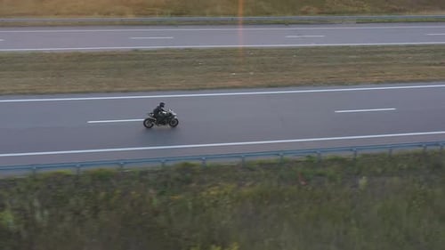 Man Riding on Modern Sport Motorbike at Highway