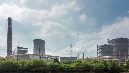 Time lapse of Steel mills and cooling towers,factory smoke stack