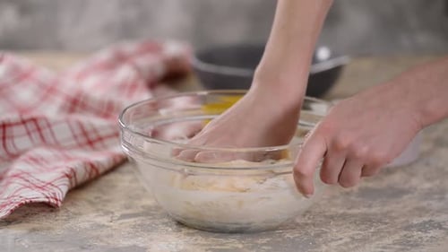 Cooking and Home Concept, Close Up of Female Hands Kneading Dough at Home