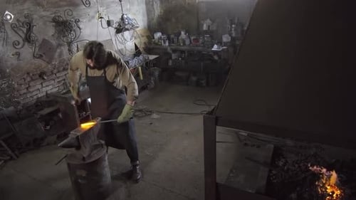 Male Worker Treating Metal Ingot in Workshop