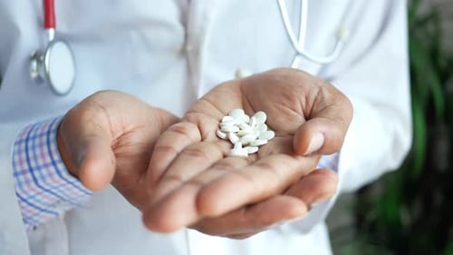 Doctor Hands Holding White Pills Medical Close Up
