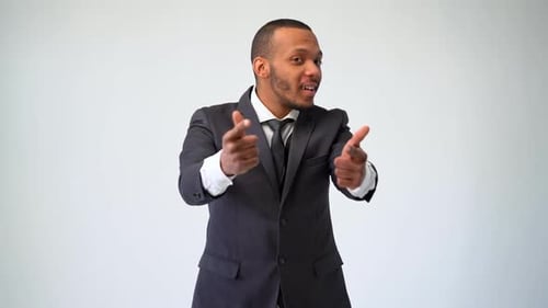 Young Adult Points Confidently at Camera