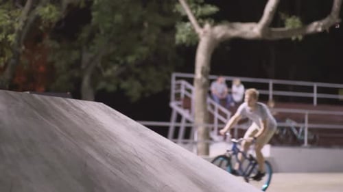 MTB Bicycle Rider Does Various Tricks While Riding in Skatepark