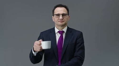 Man in Suit with Mug