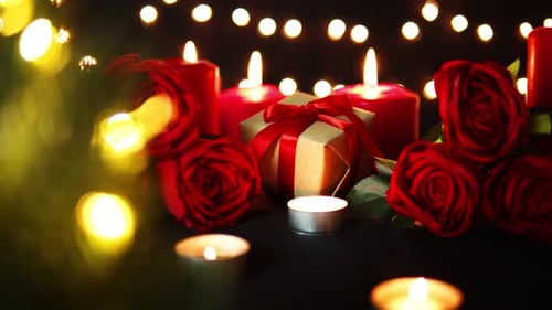 Romantic Roses, Candles, and a Gift at Night