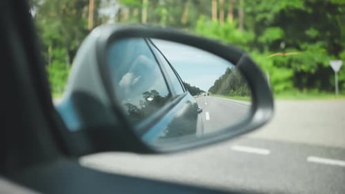The Mirror of the Car While Driving on the Motorway