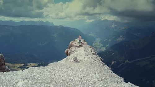 Flying Over Woman Reaching the Top of Piz Boe Mountain in Italian Dolomites
