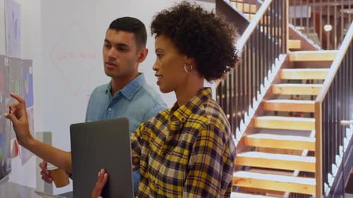 Business people discussing over chart in a modern office 4k