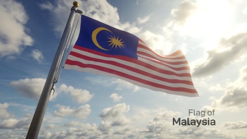 Malaysian Flag Waving Against Bright Cloudy Sky