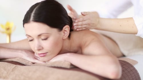 Happy Woman Having Massage At Spa