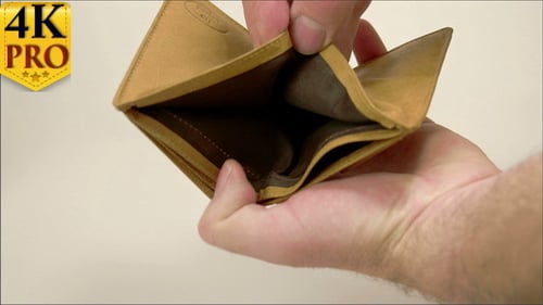 Empty Brown Leather Wallet Being Shown on Surface