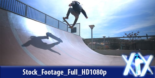 Skateboarder Practices on a Ramp in Skatepark