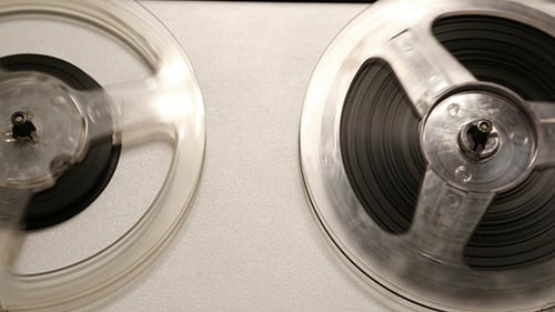 Vintage Reel-to-Reel Tape Recorder with Rotating Spools