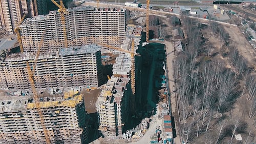 Aerial View of Urban Construction Site with Cranes