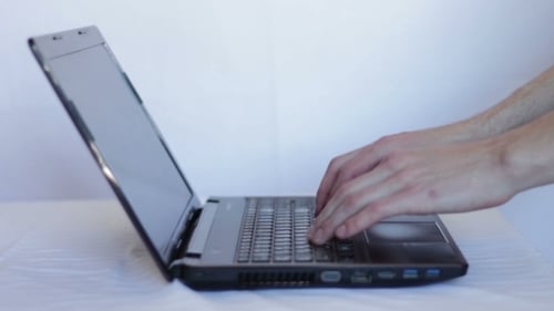 Typing on Laptop Keyboard at Home