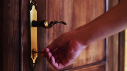 The Man Opens The Door Using The Key
