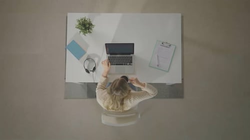 Woman Using Laptop from an Overhead Angle