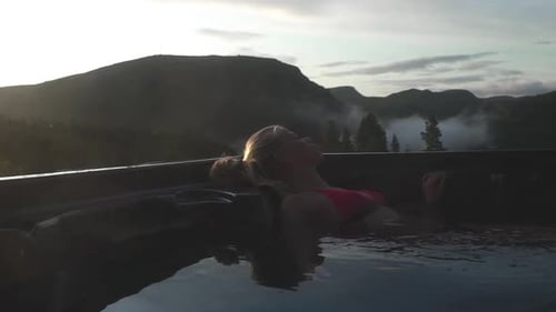 Woman In Bikini Top Relaxing And Reclining In Hot Tub