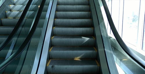 Empty Escalator Moving Upward in Bright Light