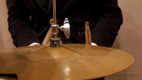 Cymbal Being Played With Drumsticks