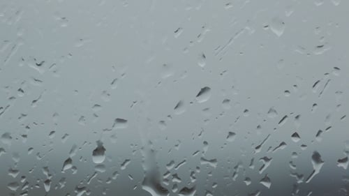 Raindrops on Glass Window on an Overcast Day