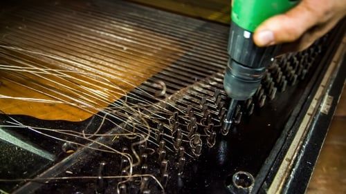 Dismantling Process Of Old Piano Strings With