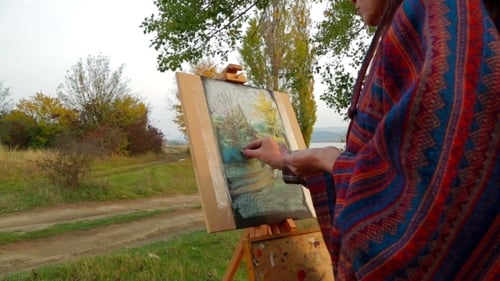 Artist Painting Rural Landscape with Pastels on Location