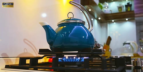 Blue Kettle on Gas Stove in Kitchen