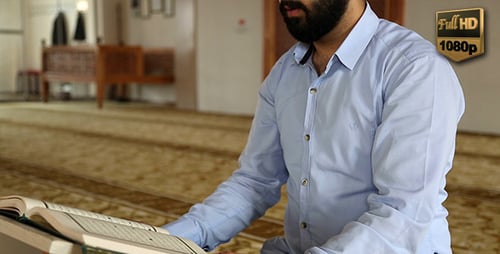 Man Reading Holy Book Indoors