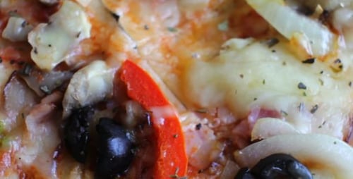 Delicious Pizza With Peppers And Olives Close Up