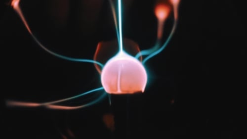 Glowing Electricity Radiating from a Plasma Ball