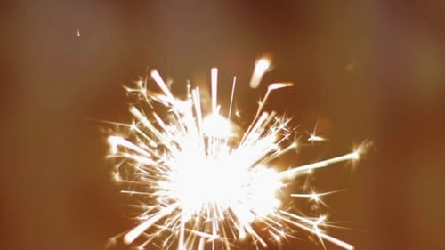 Burning Sparkler Emitting Light and Sparks