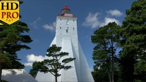 A Big White Lighthouse on the Middle of Field