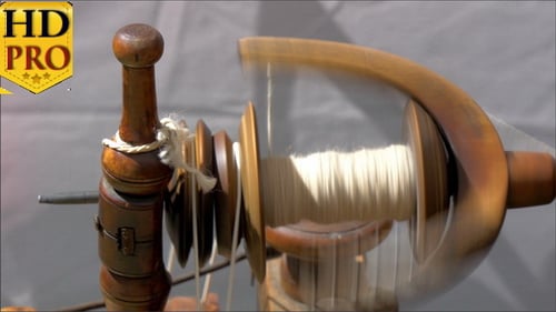 An Old Spinning Wheel Fastly Turning Around