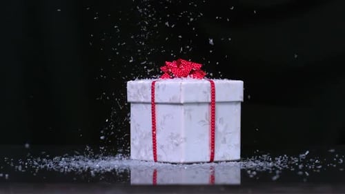 Glitter Falling Onto Christmas Present