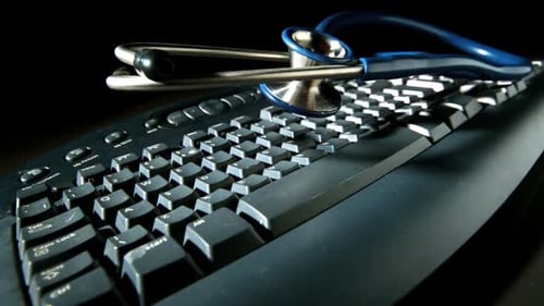 Stethoscope on Keyboard Suggests Online Medicine Concept