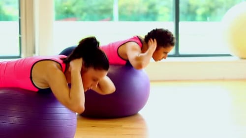 Women Doing Core Exercises on Exercise Balls