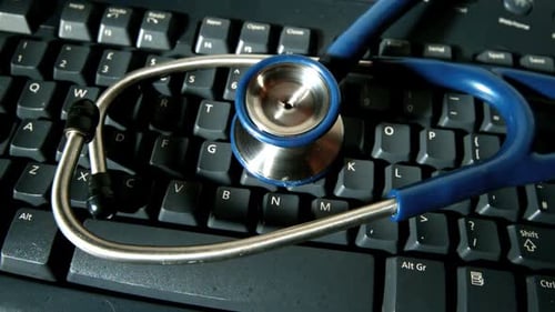 Stethoscope Lying on Computer Keyboard for Telehealth Concept