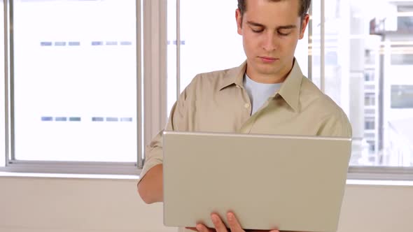 Stern Young Businessman Using His Notebook, Technology Stock Footage ft ...