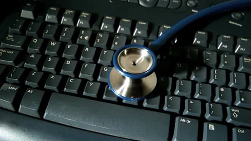 Stethoscope on Computer Keyboard for Technology Concept