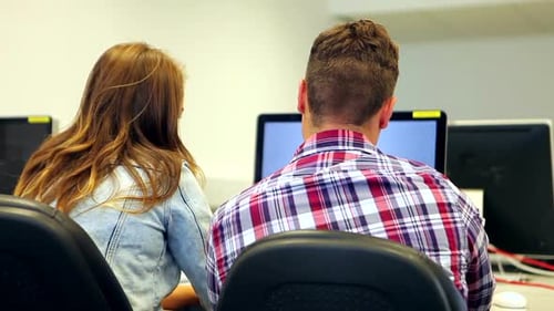 Students Learning Together In Computer Class