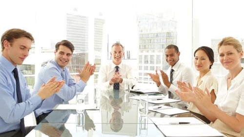 Business Team Applauding in Modern Office Building