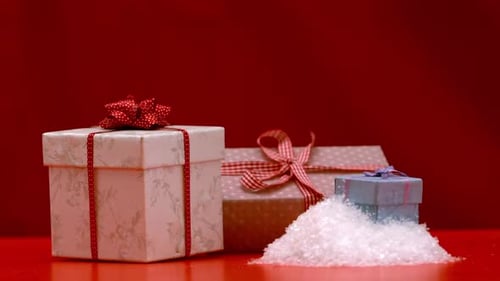 Christmas Present Falling And Bouncing On Red Background