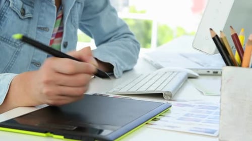 Close Up Of Young Designer Drawing