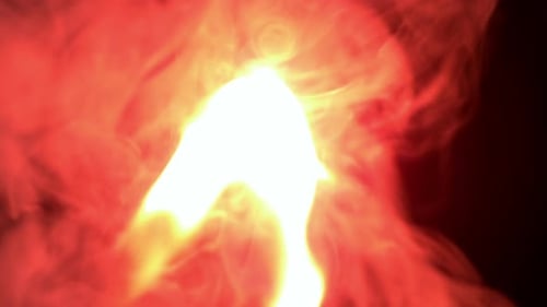 Match Lights on Fire in Dark Close Up