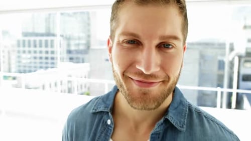 Smiling Man in Modern Office Setting
